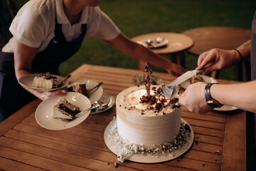 cut wedding cake with knife and cutlery