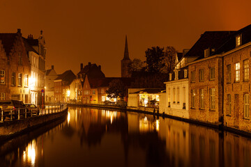 Naklejka premium Medieval buildings in Bruges, Belgium old town Brugge illuminated at night