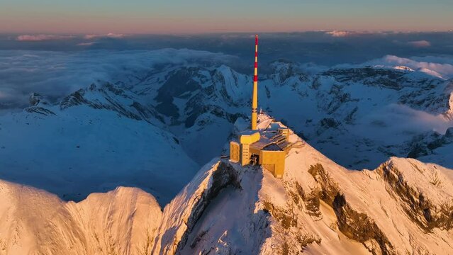 Aerial View of the Mountain Seantis in the Swiss Alps, Switzerland. Santis Weather Station, View Platform at sunset.