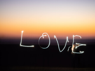 Background with glowing lines. The word love.