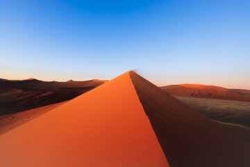 Fototapeta na wymiar incredible dunes during sunrise at sossuvlei national park in Namibia