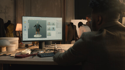 African American tailor or fashion designer creates clothes and develops future wear collection in...