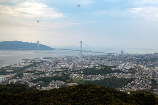 View over the city of Kobe and Akashi Kaikyo Bridge suspension bridge, linking Honshu to Iwaya. 