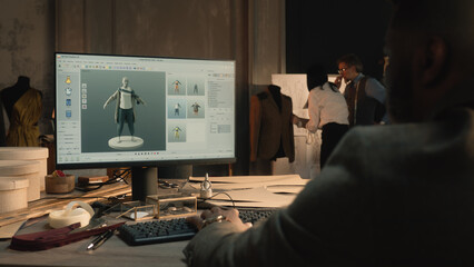 African American tailor or fashion designer creates clothes and develops future wear collection in...