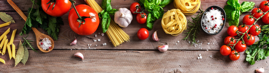 Uncooked pasta, vegetables, cooking food background