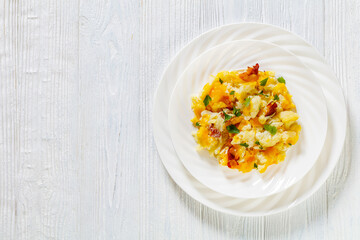 cauliflower bacon cheese casserole on white plate