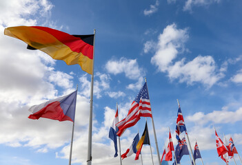 flags of countries waving during the international meeting
