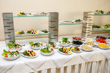 Snacks and canapes are ready for meeting guests at the event. Business conference in a hotel.