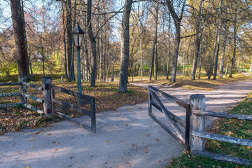 old wooden gate on the path in the park in the Pushkin mountains, Pskov, Russia