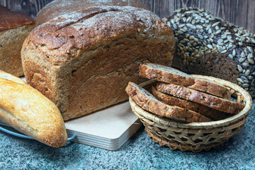 different types of wheat bread on a wooden table