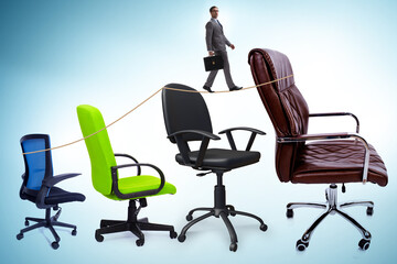 Promotion concept with businessman and chairs