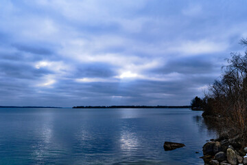 cloudy day with overcast a beautiful reflection on the calm waters 
