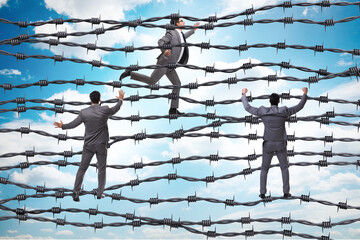 Businessman in barbed wire concept