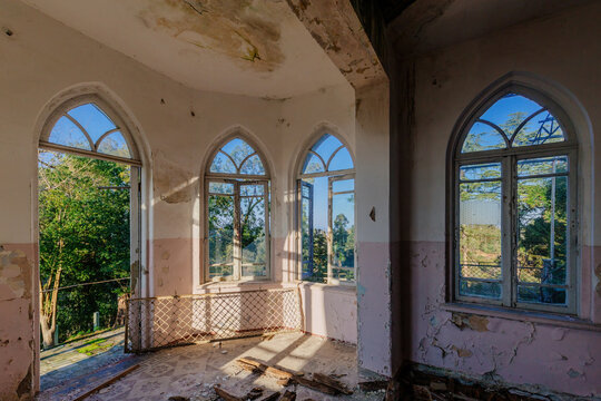 Old shabby room of abandoned mansion in gothic style