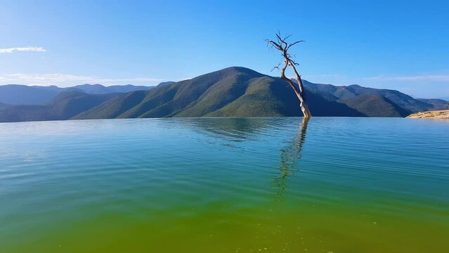 View of Hierve el Agua, is a set of natural rock formations that resemble cascades of water and small natural and artificial pools, is located about 70 km east of Oaxaca city, past Mitla, Mexico.