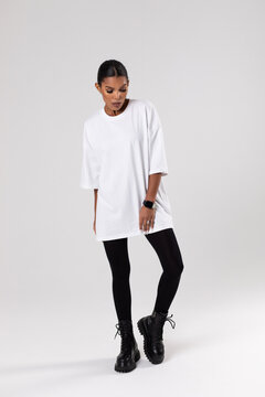 African american woman in oversized white t-shirt. Mock-up.