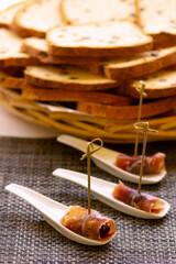 Jamon. Dry Spanish ham, Bellota, Italian Prosciutto Crudo or Parma ham. Slicing Spanish iberic ham...
