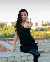 Young pretty woman standing on roof