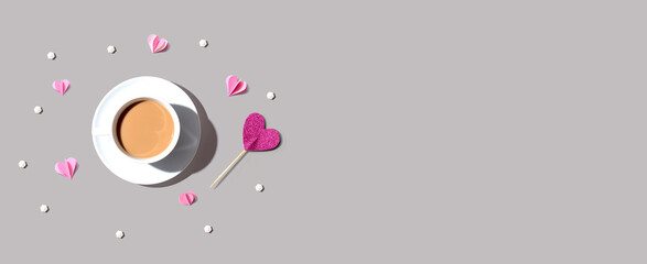 A cup of coffee with paper hearts - flat lay