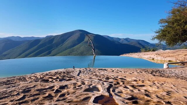 Traveling of Hierve el Agua, is a set of natural rock formations that resemble cascades of water and small natural and artificial pools, is located about 70 km east of Oaxaca city, past Mitla, Mexico.