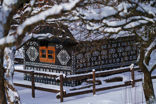 typical original architecture with paintings on wooden houses, unique for the village of Cicmany