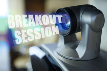 A blue beam glows from the projector inside which is the inscription - Breakout Session