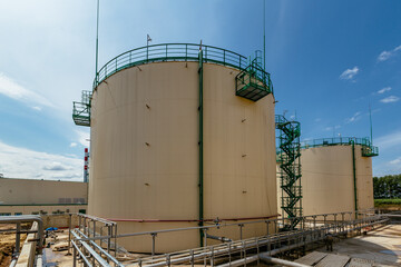 Large industrial round tanks for chemical production or oil. Construction of chemical factory
