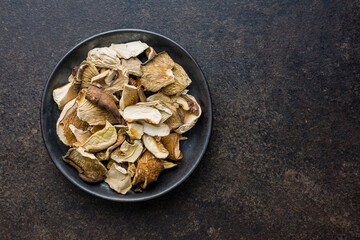 Sliced dried mushrooms on plate. Top view.
