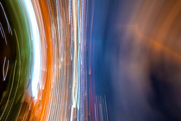 Abstract blurred bokeh neon light trails city night background