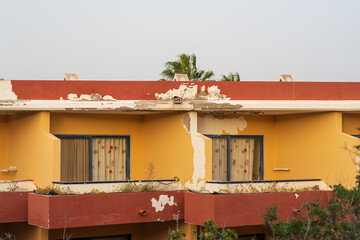 Rooms from the outside of an old dilapidated hotel complex in the evening light on Fuerteventura 
