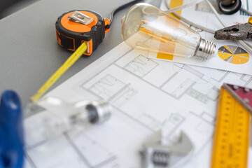 Computer Tablet Showing Kitchen Illustration Sitting On House Plans With Pencil.