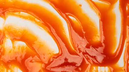 Red sauce splashes as background.