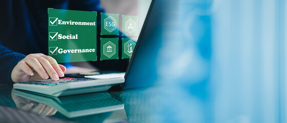 ESG. environment social governance investment business concept. Businessmen use a computer to...