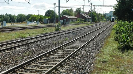 A local train in Scandinavia arriving to a train station