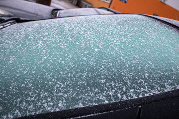 Frozen windshield in the car - 560256066