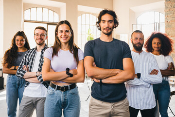 Portrait of six self-confident working people with folded arms - Operational team of a small newborn start-up - University students before exam - Copy space - Concept of team-leader and teamwork - 560257276