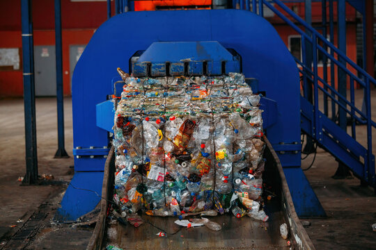 Modern waste processing plant. Pressed and packed plastic bottles