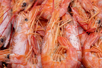 Selective focus, Shrimps background texture. A lot of shrimps. Cooked shrimps.