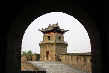tower on a rampart in an old Chinese town