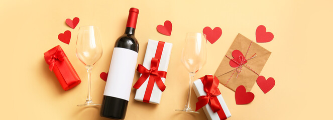 Bottle of wine, glasses, letter and gifts for Valentines Day on color background