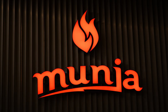 Warszaw, Poland - December, 2022: Munja logo. Incendiary Adriatic cuisine Munja in Warsaw