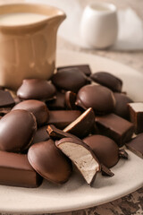 Plate with sweet bird's milk candies, closeup