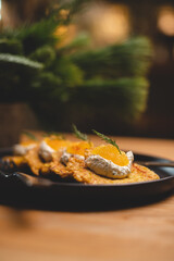 Potato meal with cream cheese and pike caviar. Food photography. Restaurant serving food. Delicacy.