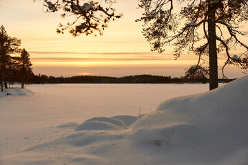 sunset over lake in the snow