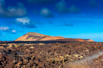 Fototapeta na wymiar Lava path for Caldera Blanca Volcano in Lanzarote, Canary Islands, Spain