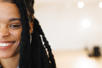 Image of happy african american female hip hop dancer posing to camera with copy space