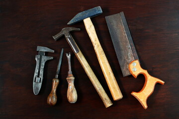 A selection of vintage wooden handled tools.