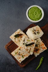 Spongy white dhokla - popular Gujarati steamed breakfast with rice or rava served with green chutney