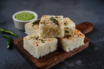 Spongy white dhokla - popular Gujarati steamed breakfast with rice or rava served with green chutney