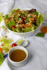 Plate of salad on white tablecloth